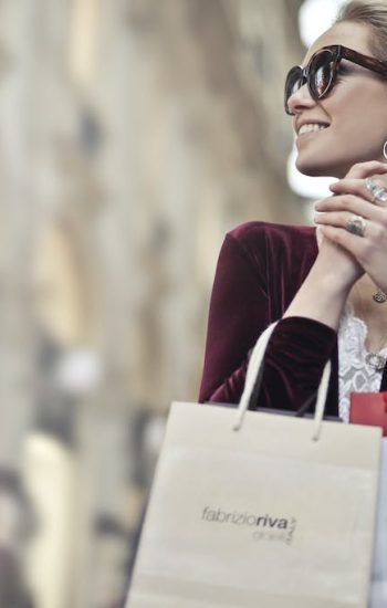 Photo of a Woman Holding Shopping Bags